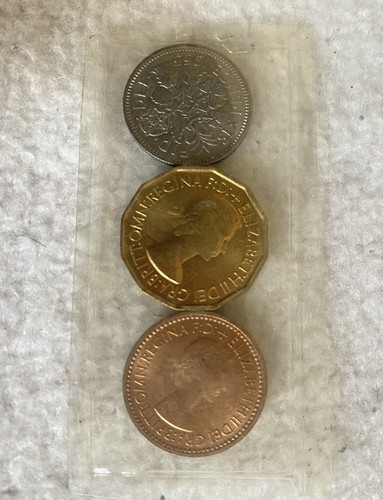 Three uncirculated british - three,